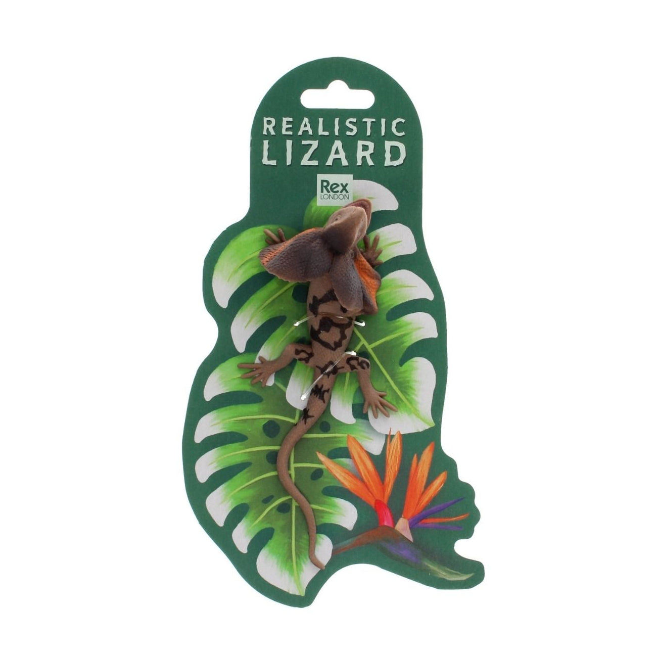 Realistic lizard toy with packaging featuring tropical leaves and flowers on a white background