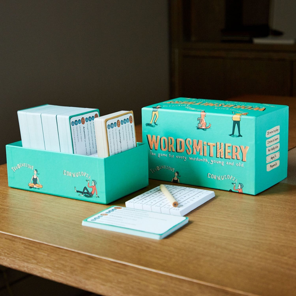 Board game 'Wordsmithery' with components on a wooden surface