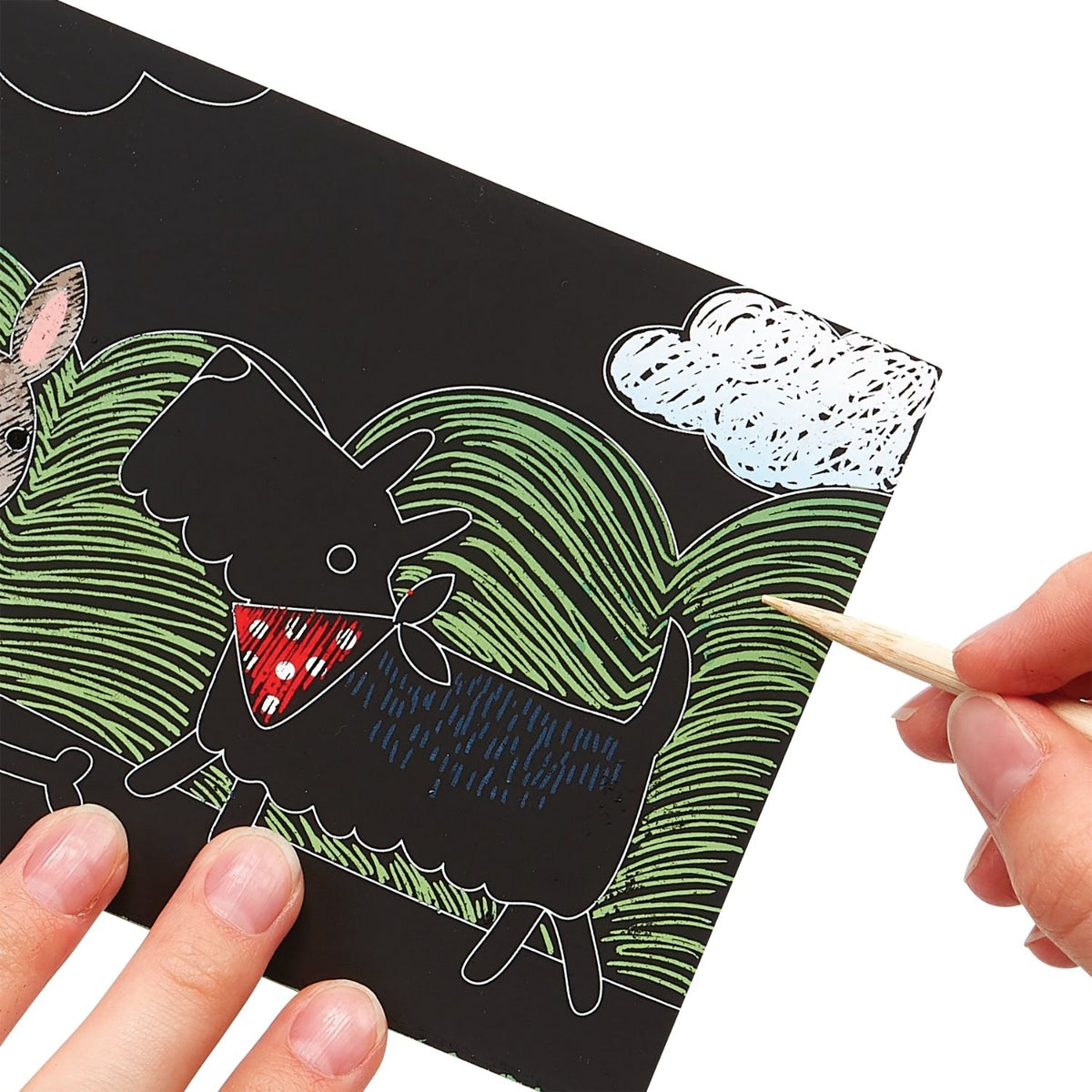 Packaging for a Mini Scratch &amp; Scribble Art Kit featuring playful puppies, including scratch cards and a wooden scratching tool.