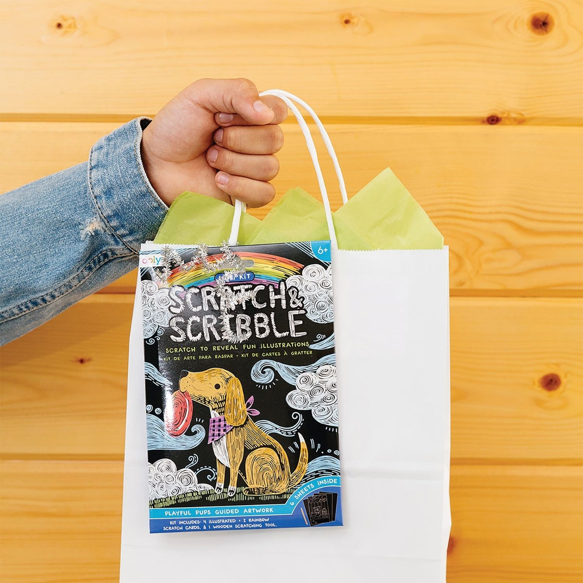 Packaging for a Mini Scratch &amp; Scribble Art Kit featuring playful puppies, including scratch cards and a wooden scratching tool.