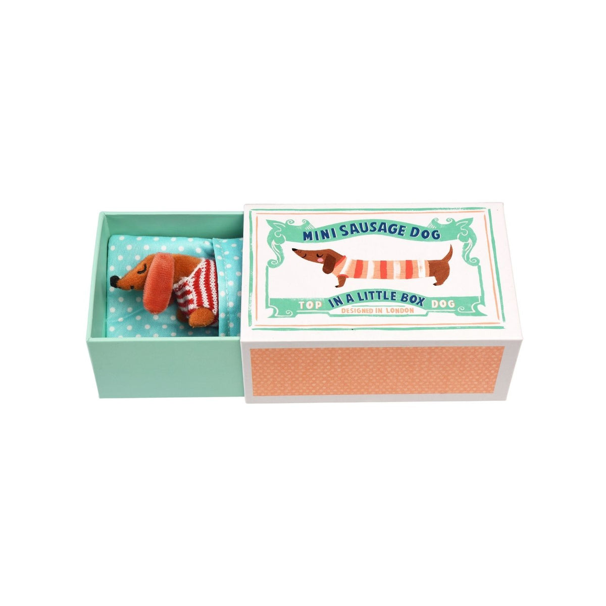 Miniature sausage dog toy in a decorative box on a white background