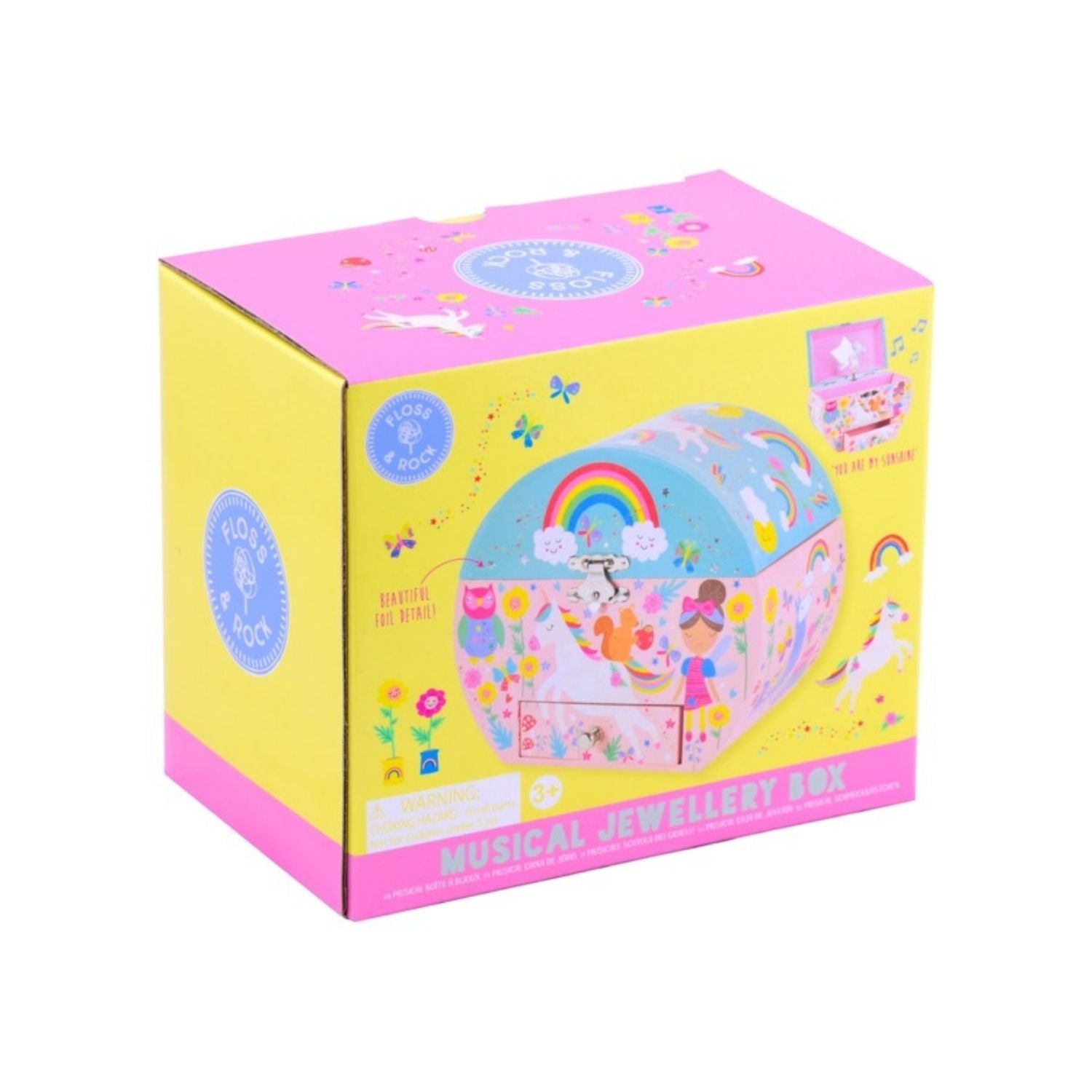 Packaging of a musical jewellery box with illustrations of fairies, unicorns, and rainbows. The box is oval in shape and appears to be for kids.