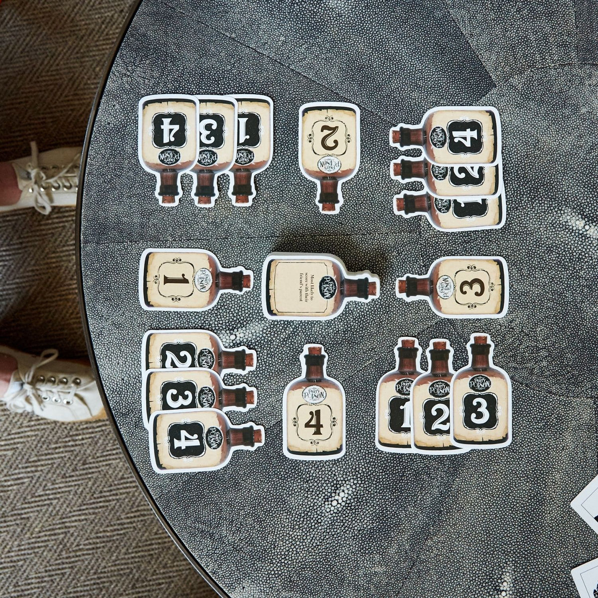 card set of numbered bottle designs on a textured surface