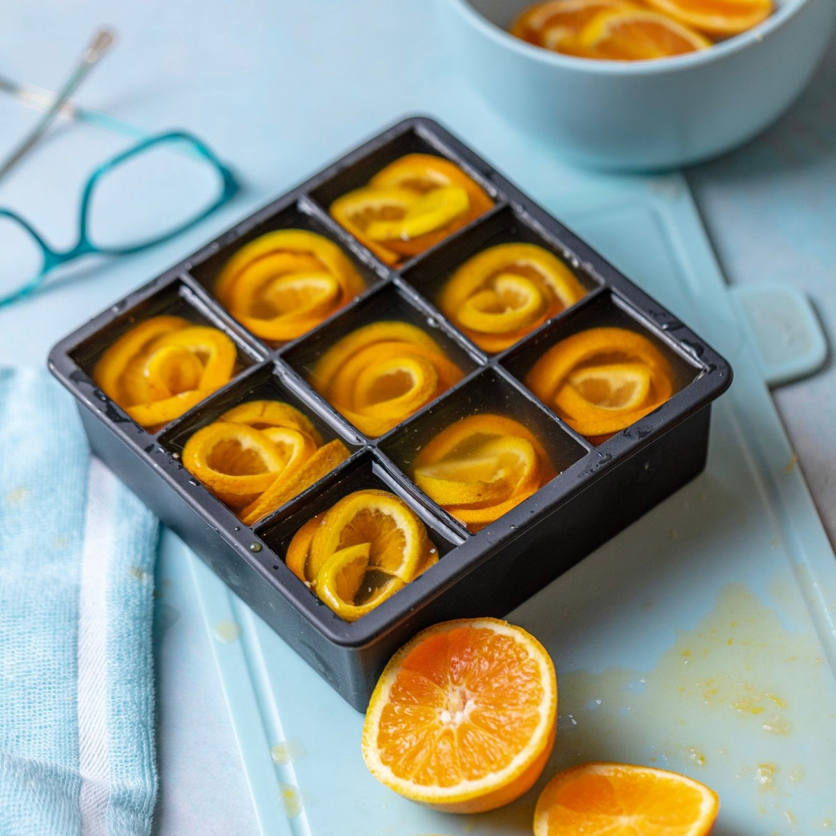 Ice cube tray with orange slices - bold slow melting ice cubes for luxury drinks and entertaining.