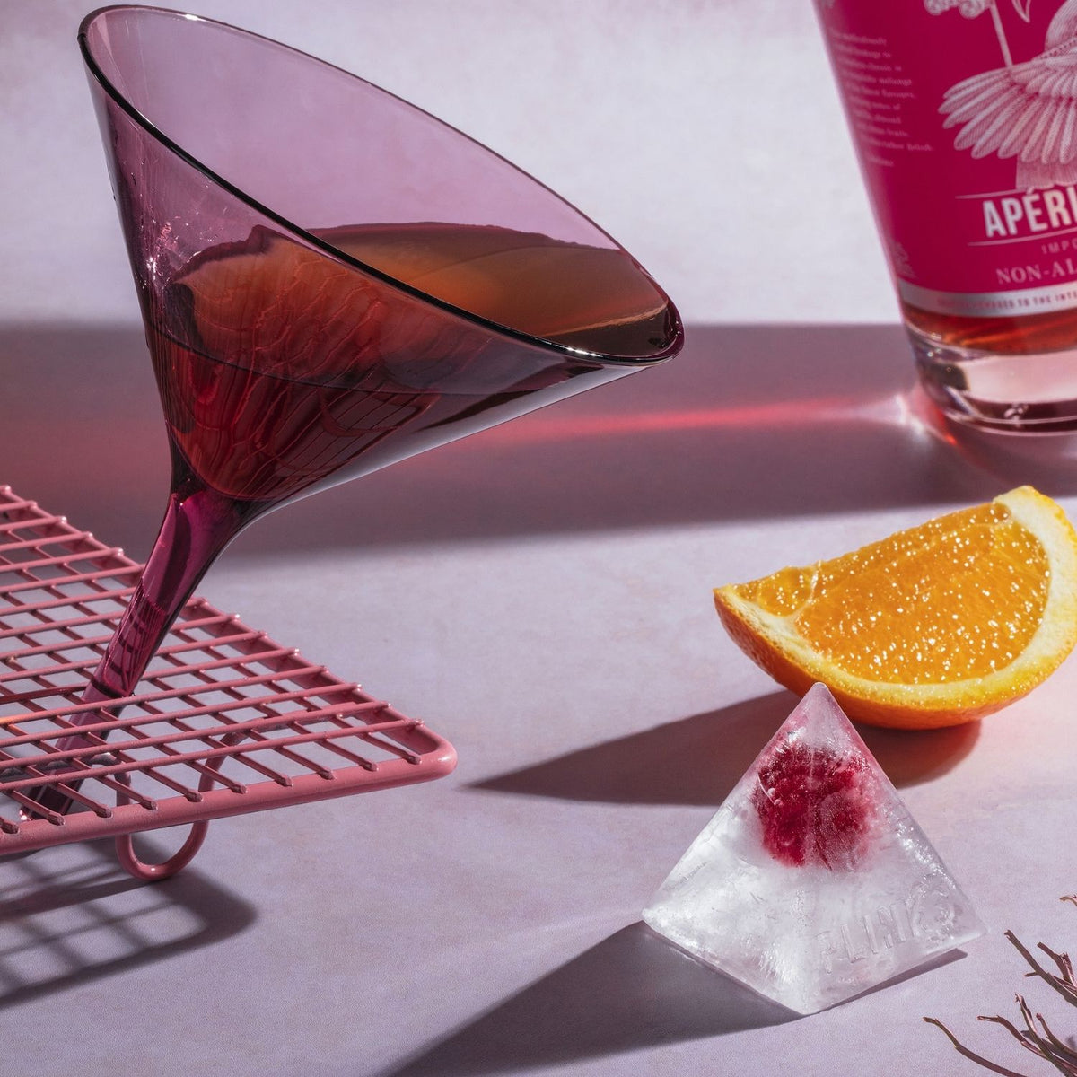 Pyramid ice cube tray in flexible food grade silicone creating nine bold ice cubes for cocktails and entertaining.