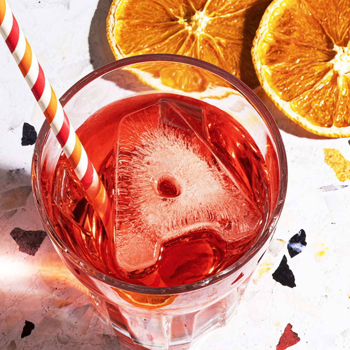 DrinksPlinks Letter A Ice Cube for Aperol Lovers in glass of Aperol