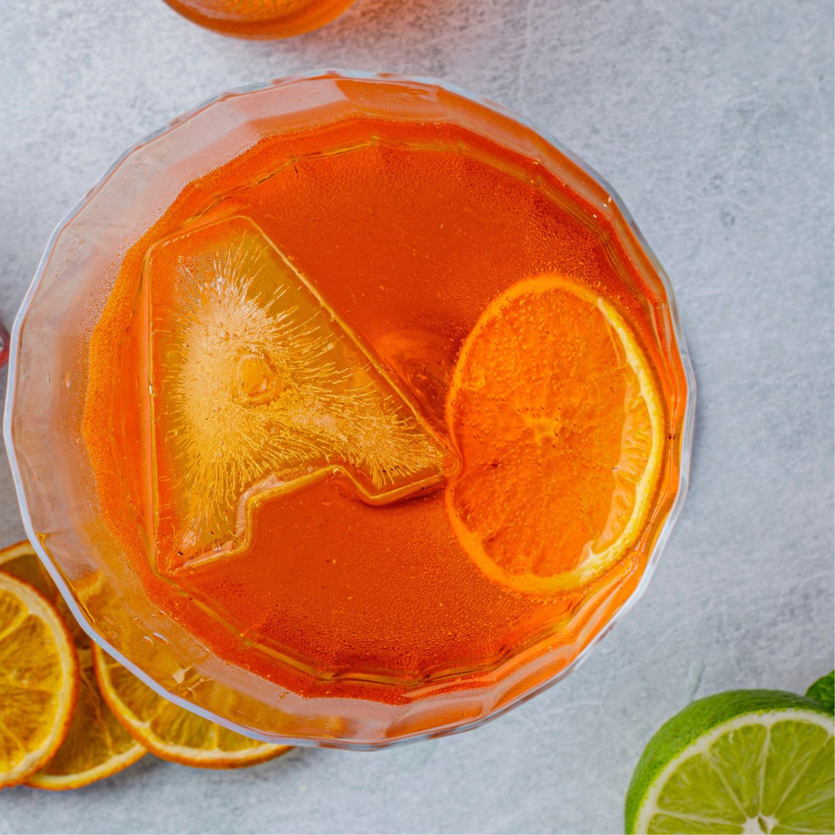 DrinksPlinks Letter A Ice Cube for Aperol Lovers in glass of Aperol