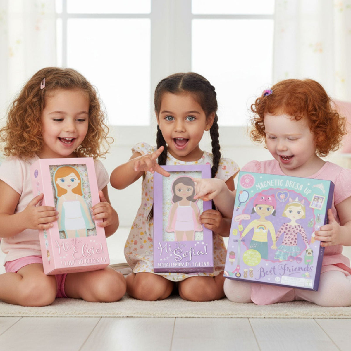 Children holding Magnetic dress up dolls