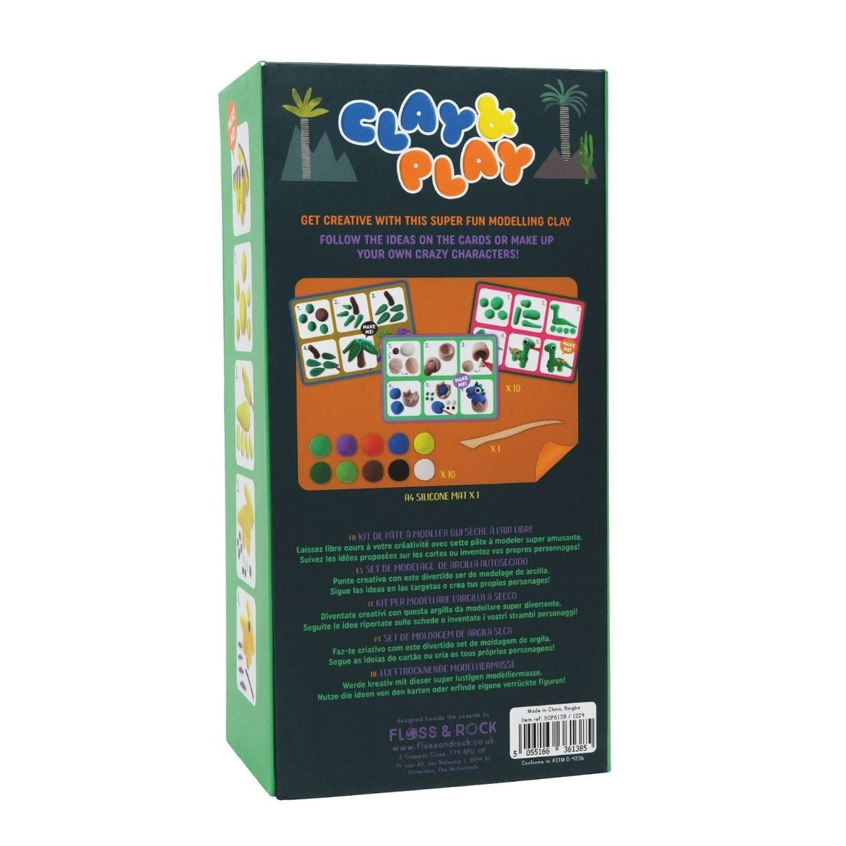 Packaging for 'Clay & Play' dinosaur craft kit, featuring colorful clay pots and dinosaur shapes, with a wooden stylus tool and a silicone mat.
