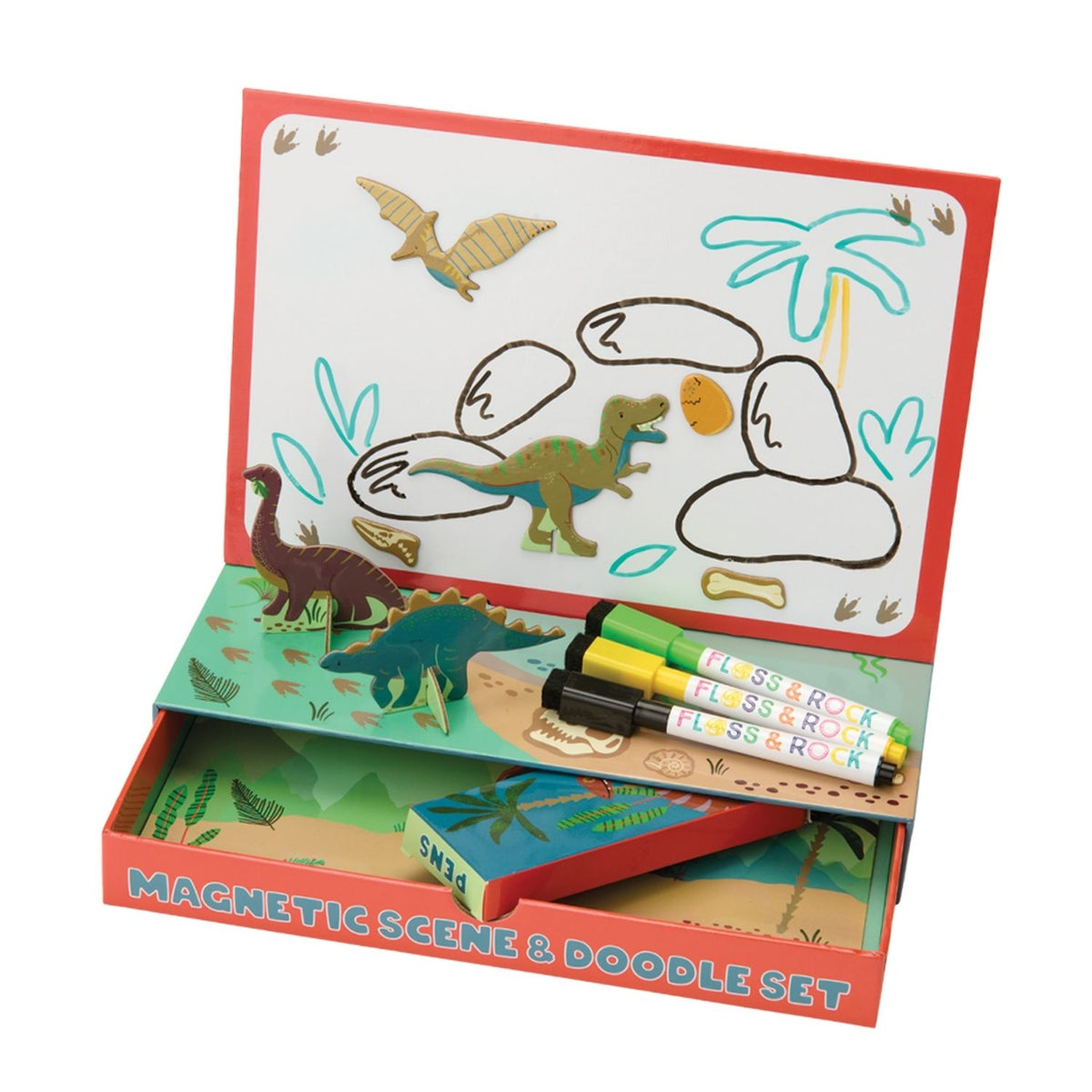The Floss & Rock Enchanted Magnetic Scene & Doodle Set opened to reveal a colourful forest backdrop, various dinosaur character magnets, and three dry-wipe pens.