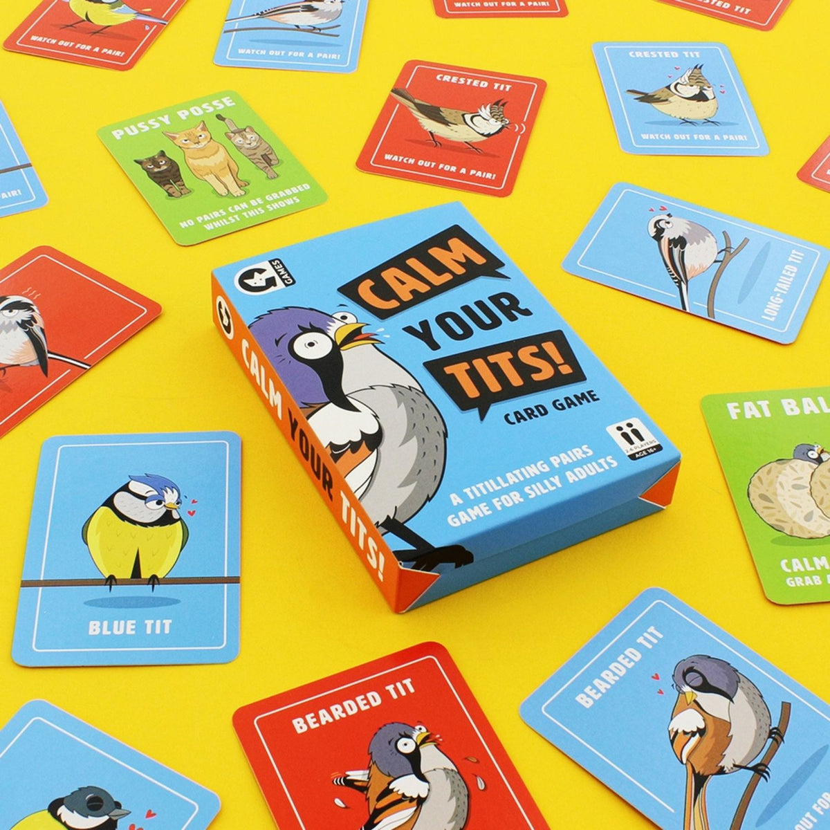 Card game box titled 'Calm Your Tits!' with cards featuring cartoon birds on a yellow background