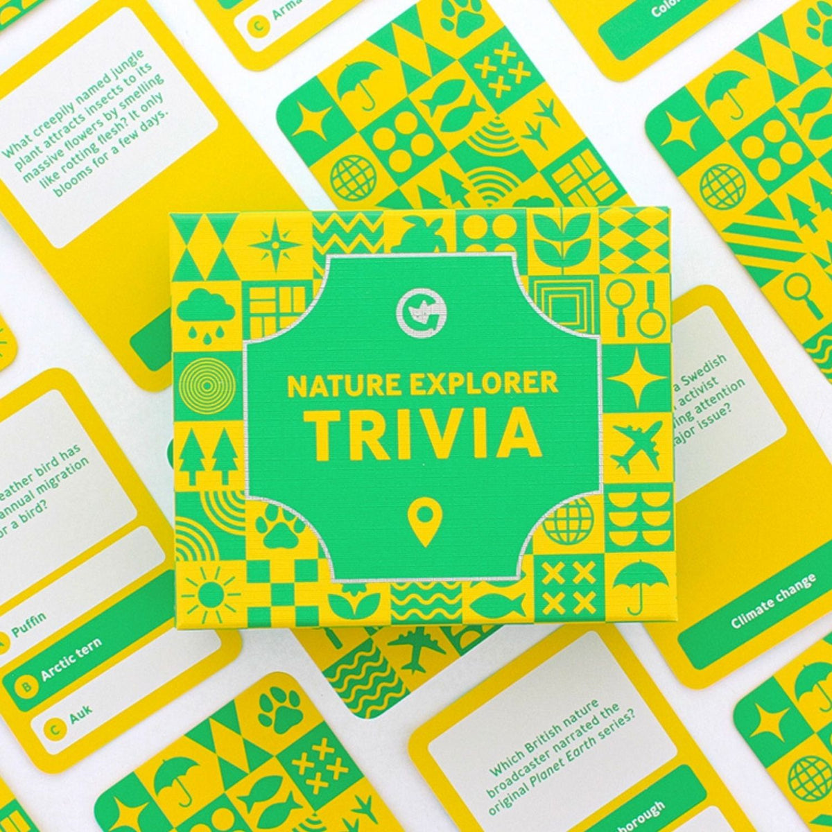 Nature Explorer Trivia box on top of the game cards with green and yellow design 