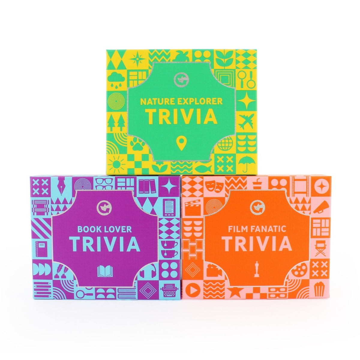 Three trivia game boxes with colourful covers. Nature Explorer trivia, Book Lover trivia and Film Fanatic trivia