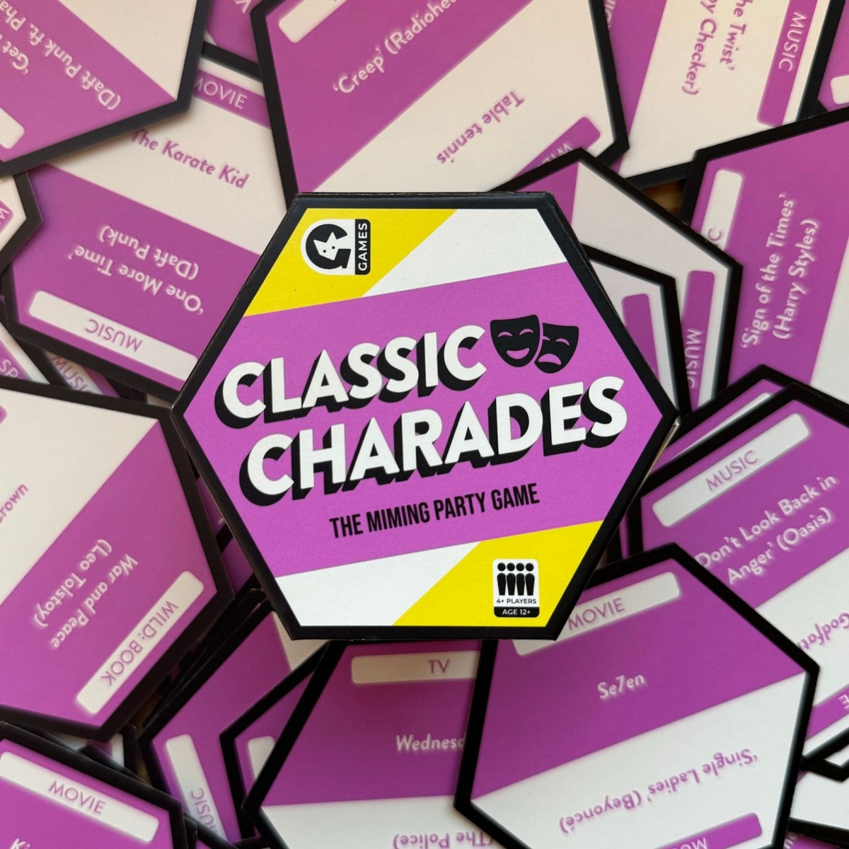 Purple 'Classic Charades' game cards with a central card displaying the game name.