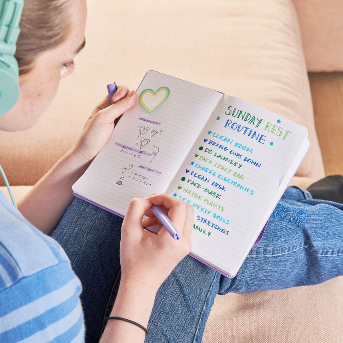 Creative Journaling: A student using the fine tip to write in a school planner and then flipping the marker to add a star stamp next to an important date.