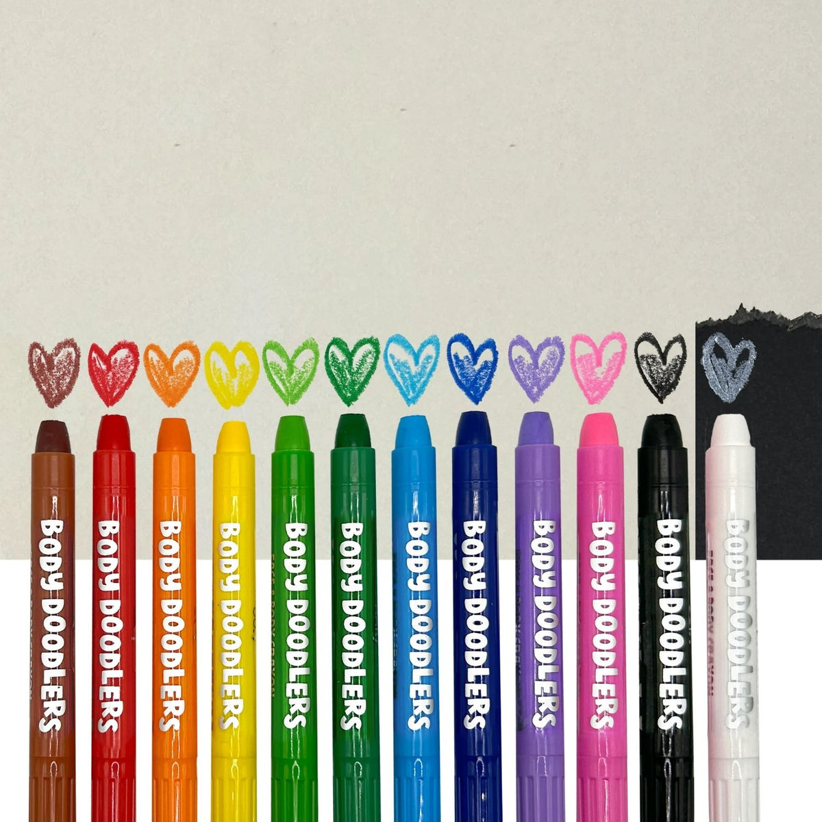 Set of Body Doodlers markers in various colors with heart-shaped color swatches 