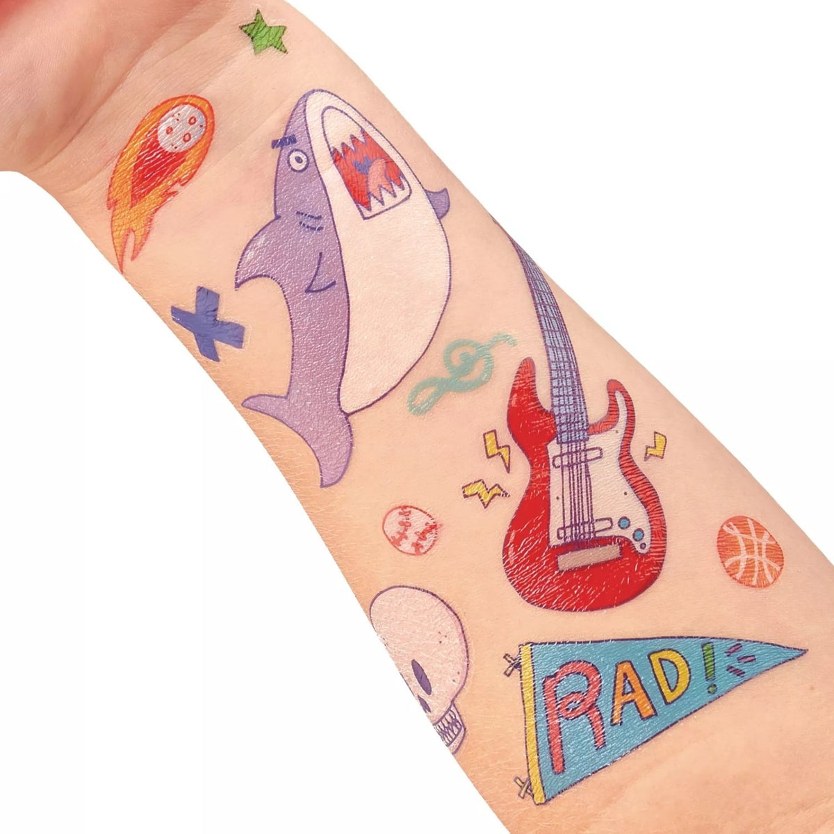Colorful temporary tattoos on a person's arm including a shark, guitar, and 'RAD' flag.