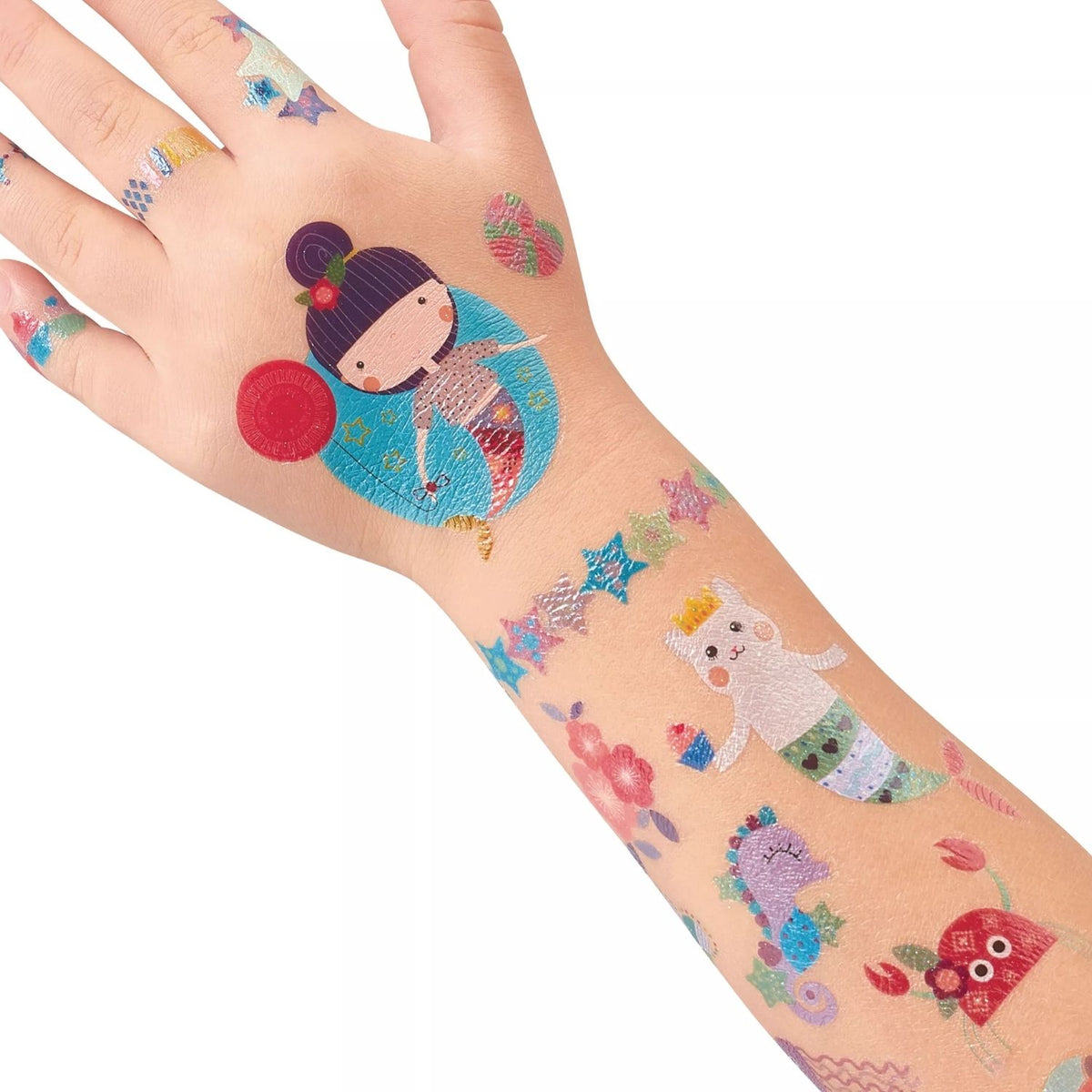 Colorful temporary tattoos on a child's arm with cartoon designs.