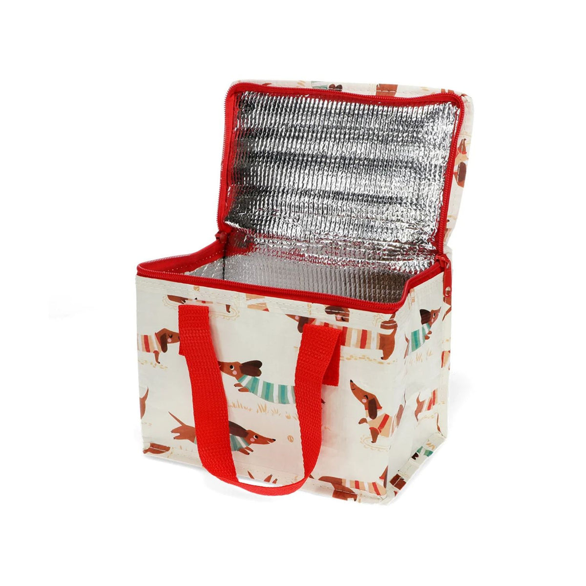 Insulated lunch bag with red handles and dog pattern showing interior view of the shiny silver foil lining designed to insulate food and a spacious compartment for containers.
