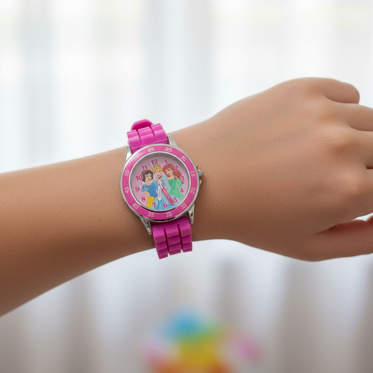 Kids wearing Disney Princesses time teacher watch designed for learning to tell the time
