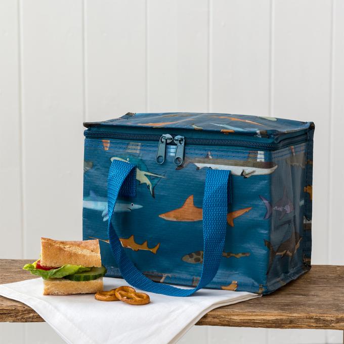 Sustainable and stylish, this insulated sharks lunch bag repurposes plastic waste. A durable, wipe-clean essential for keeping snacks cool on the go.